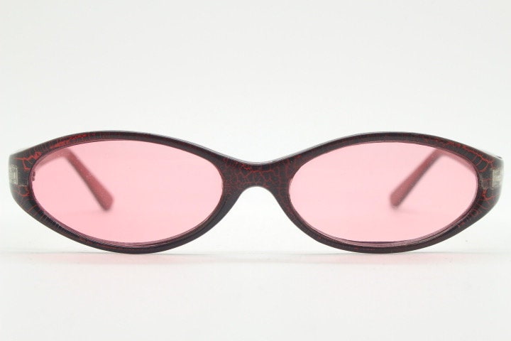 90s vintage abstract oval sunglasses. Thick curve around pink frame with psychedelic light pink lenses. Super villain mini mask. Cosplay NOS