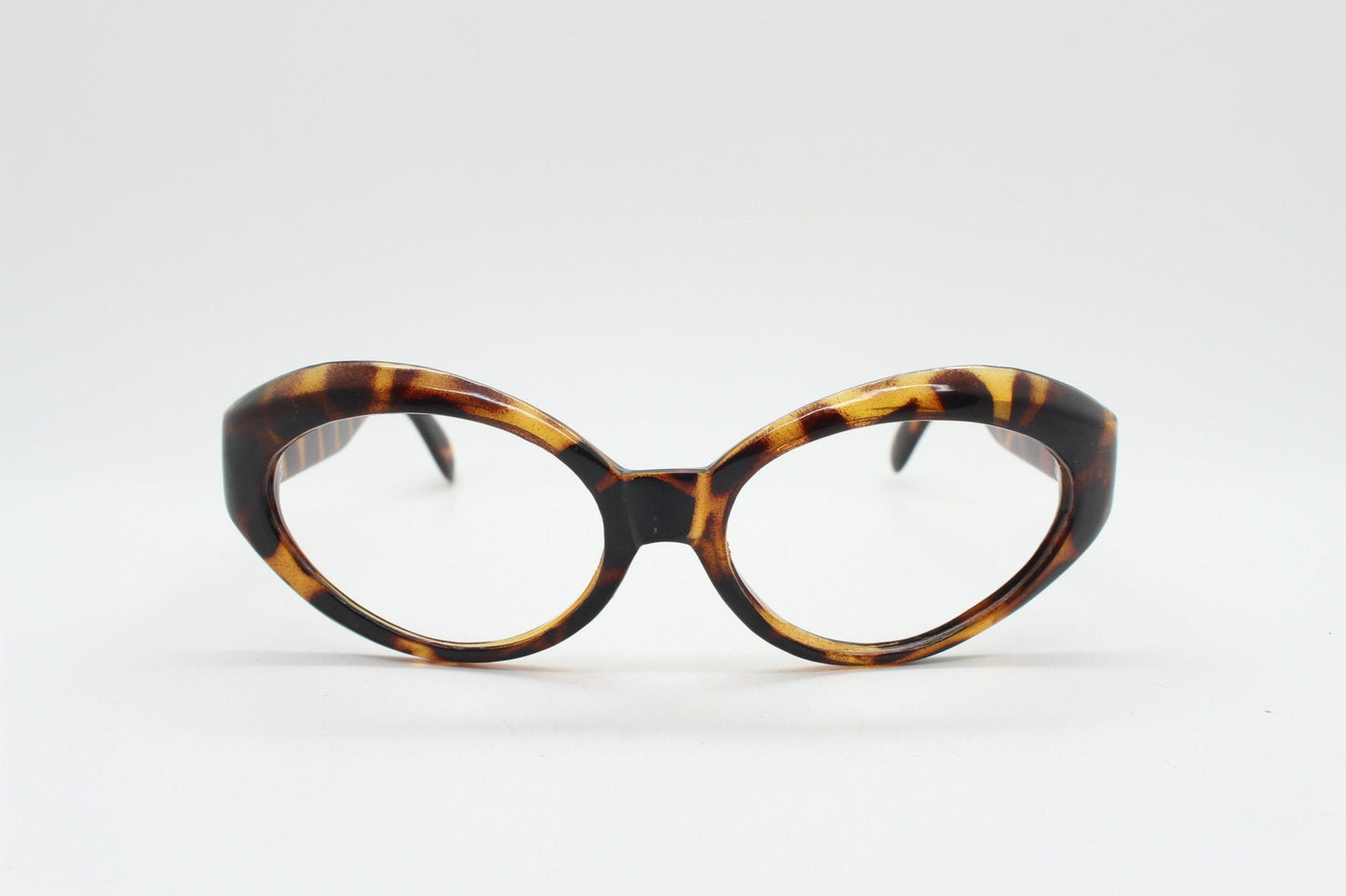 80s vintage oval cat eye glasses. Crop sided dynamic tortoise cateye optical frames. 60s style prescription eyeglasses. RX spectacles. NOS