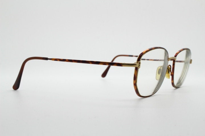 Giorgio Armani 90s vintage angular squared eye glasses made in Italy. Subtle metallic satin tiger print optical frames. Prescription RX