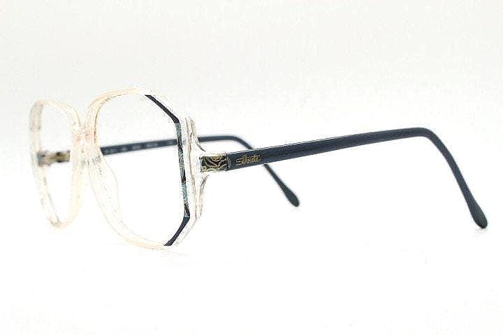 Silhouette 80s vintage hexagon eye glasses made in Austria. Transparent crystal optical frame with abstract blue pattern. Prescription. 70s
