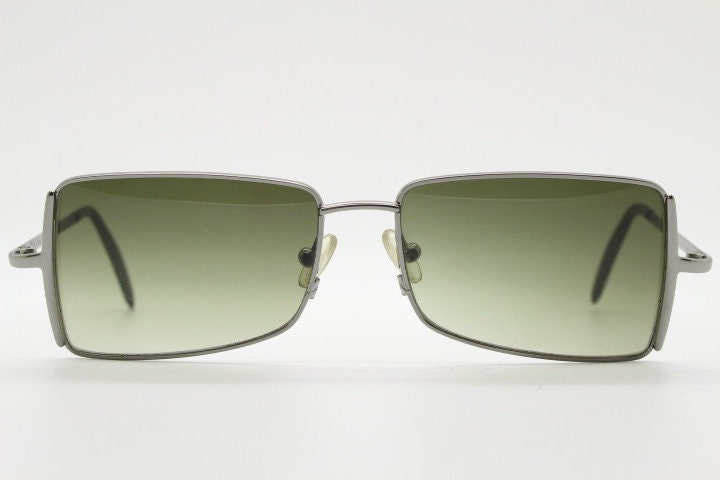 Exte rectangular 90s vintage sunglasses made in Italy. Grey chrome low profile frame with graduating green lenses