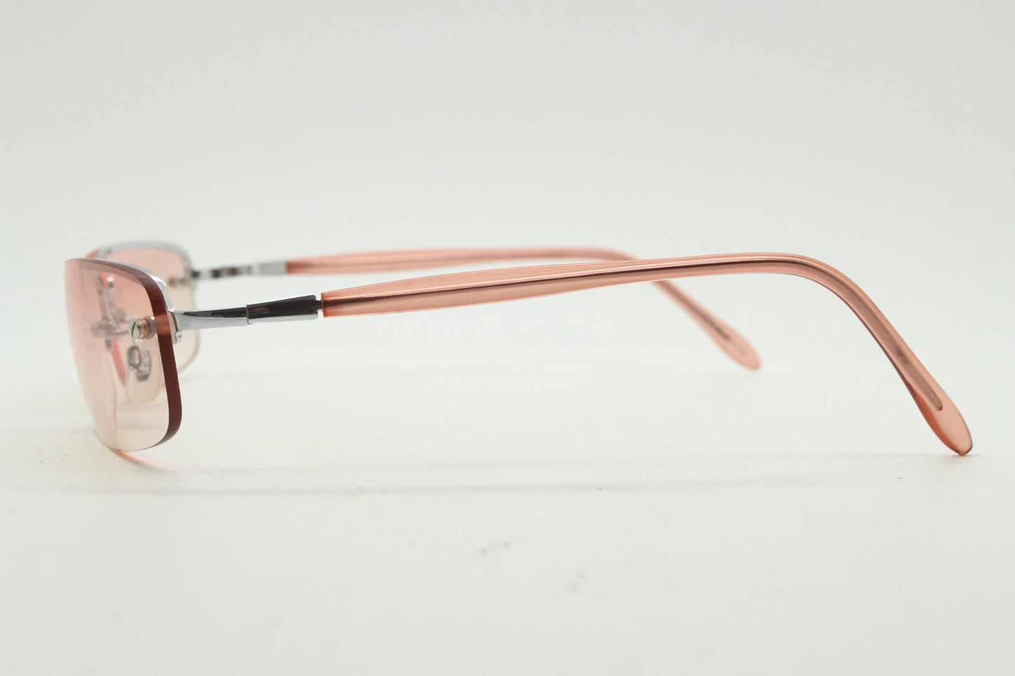 Y2K vintage wrap around rectangular sunglasses. Half frame in sharp chrome with extra light tone pink lenses. Rave 2000's. 00's NOS