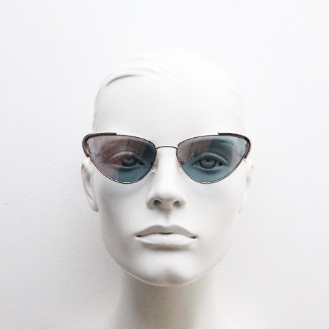 Rebecca Minkoff futuristic golden oval cat eye sunglasses. Women's rose gold metal cateye frame with sunburst mirror lenses. NOS