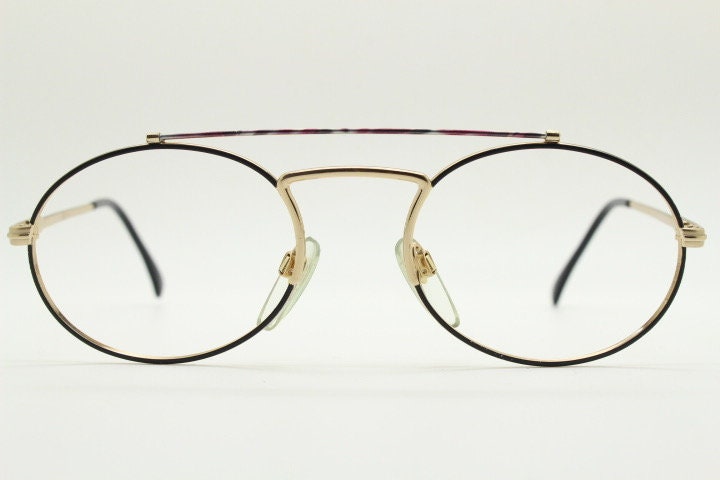 90s vintage oval eye glasses. Gold metal optical frame with vibrant enamel pattern and prominent double bridge. Prescription spectacles. NOS