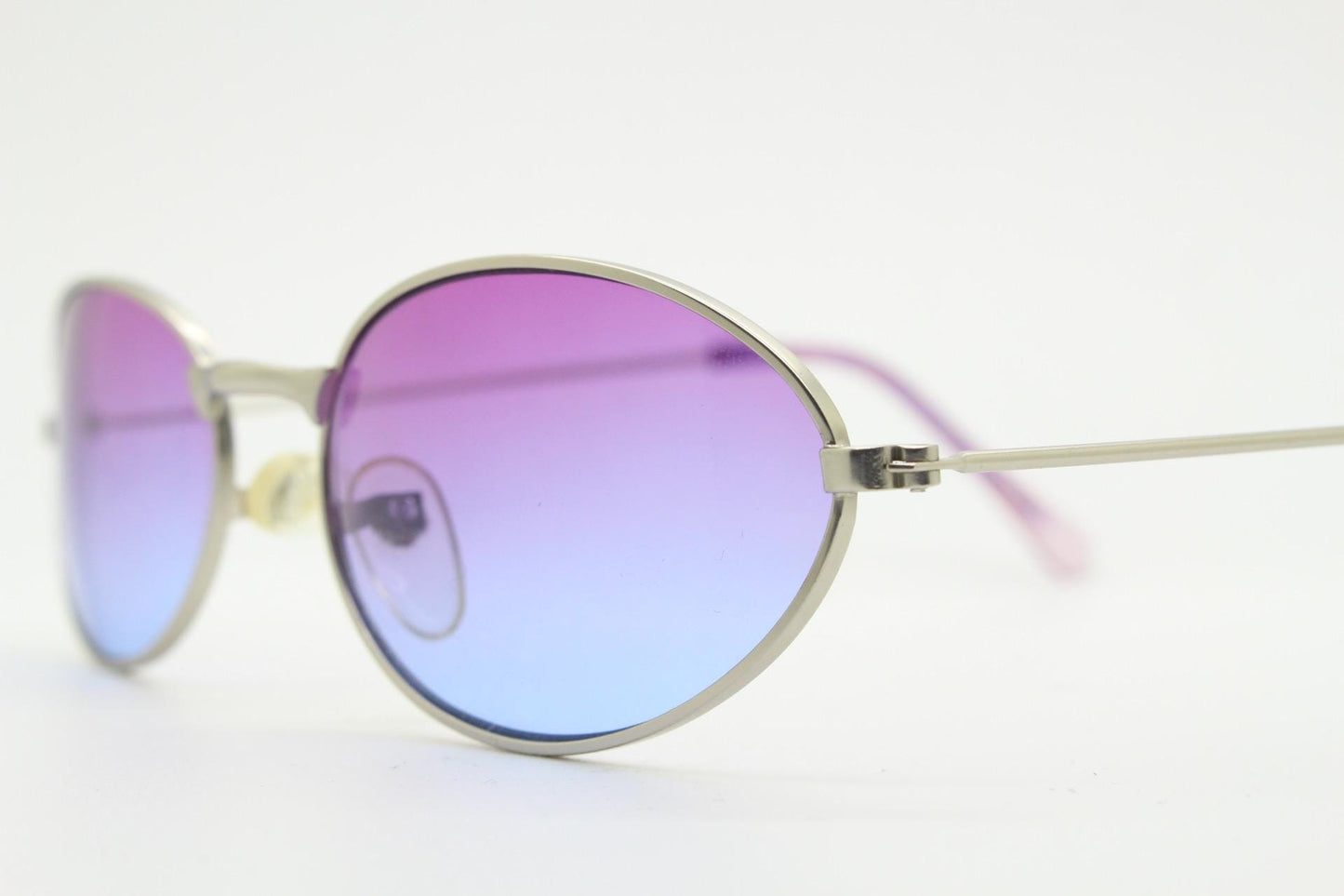 90s vintage small bug eye oval sunglasses. Silver satin frame with impressive pink to blue ombre graduating lenses. Y2K. 2000s. Unworn NOS
