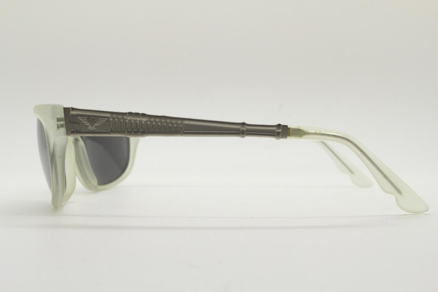 Dakota Smith vintage 90s futuristic sunglasses. Transparent frosted wrap around shield frame with mirror lenses and ornate arm patterns