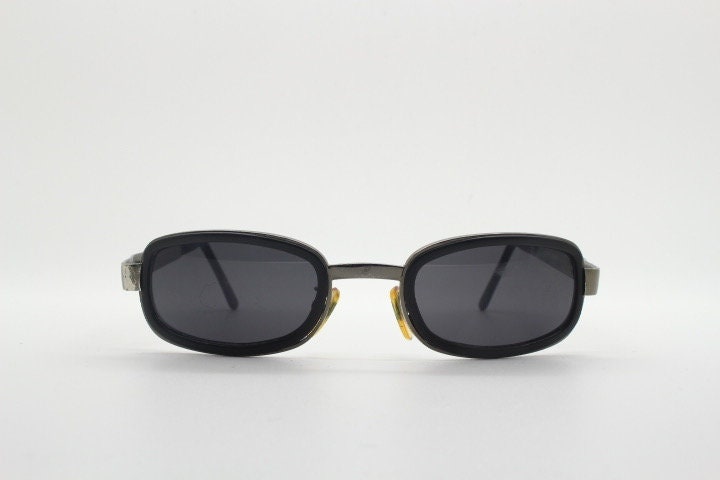Byblos 90s vintage low profile rectangular sunglasses made in Italy. Gunmetal grey chrome frame with black insets and cut out arm logo's