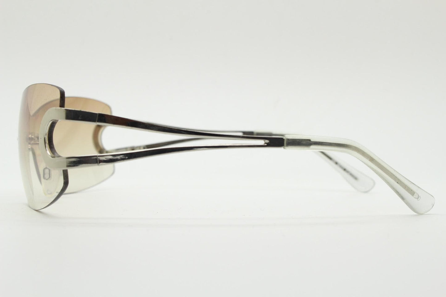 Y2K vintage visor sunglasses. 2000's brown wraparound mono lens shield design with looped chrome temples. 00s uber fashion mini mask NOS