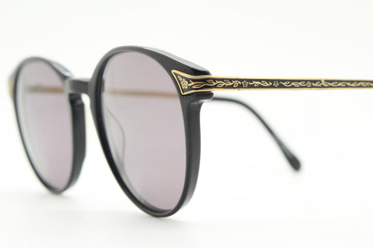 Laura Ashley 90s vintage round sunglasses. Refined 1940s design in black acetate with ornate embossed metal arm details. Unused NOS