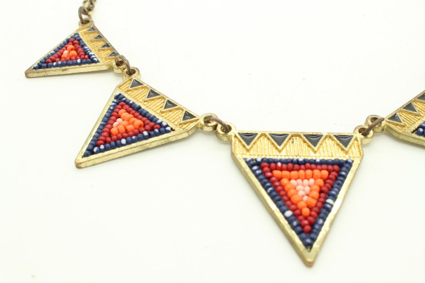 80s vintage gold triangles necklace. Aztec style with multi coloured bead inlays and ornate patterns. Womens statement design