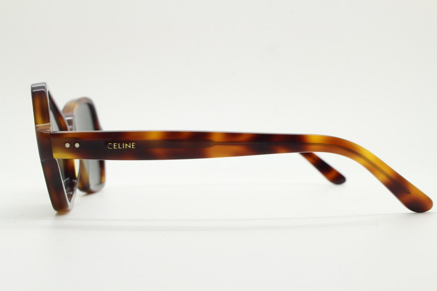 Celine Paris vintage angular cat eye sunglasses made in Italy. Tortoise butterfly frame in good proportions with green lenses. Womens Y2K