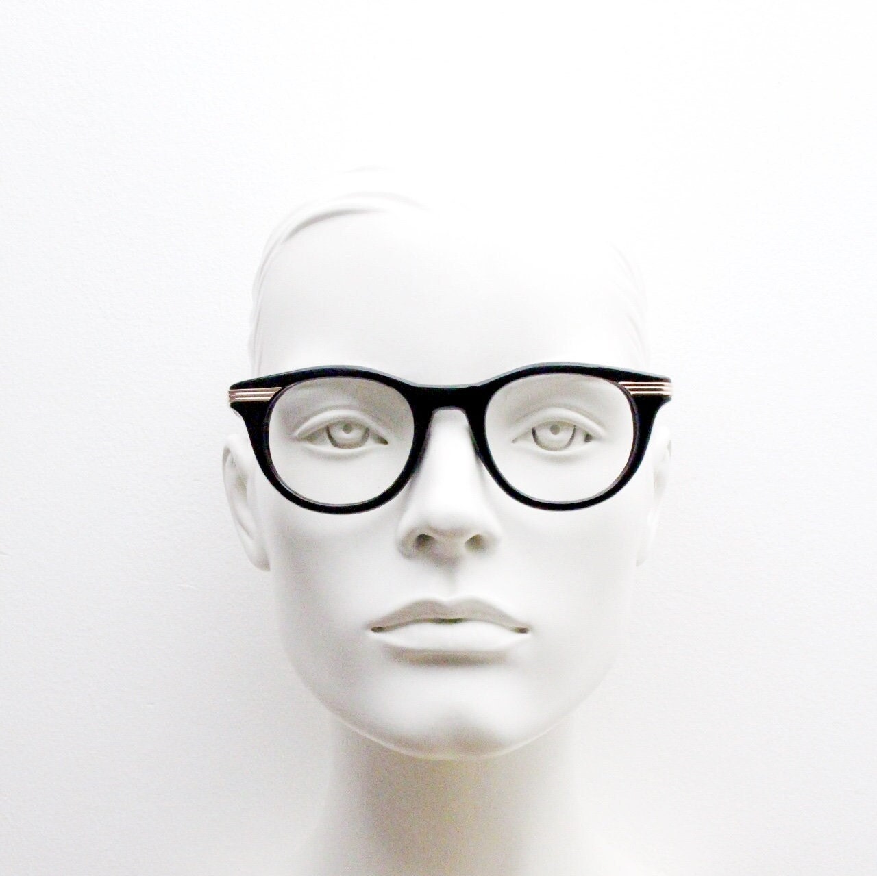 90s vintage cat eye glasses in black with gold metal arms. 50s, 60s style cateye prescription optical frames. Clear lens eyeglasses. RX