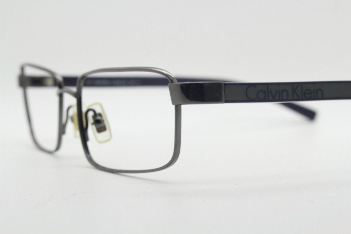 Calvin Klein collection rectangular eye glasses model 582 made in Japan. Gunmetal grey wire optical frames. Prescription eyeglasses. RX