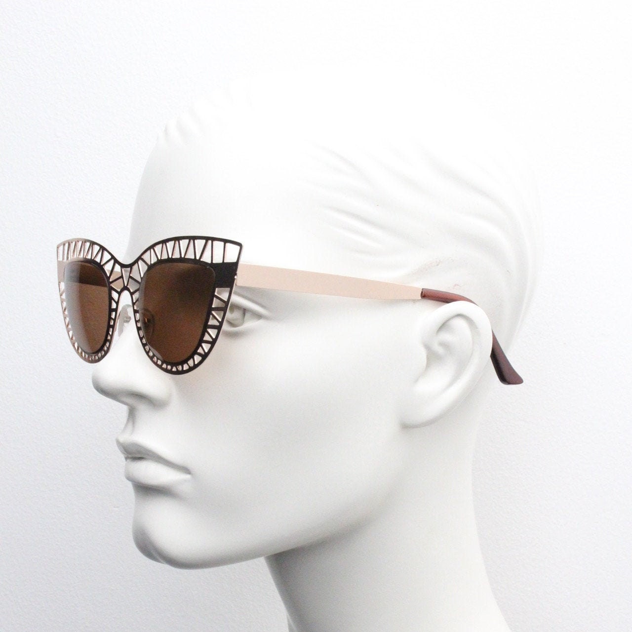 Y2K vintage metal cat eye sunglasses.  Women's extraordinary gold cut out lattice scaffold cateye frame with brown lenses. 2000s. BNWT