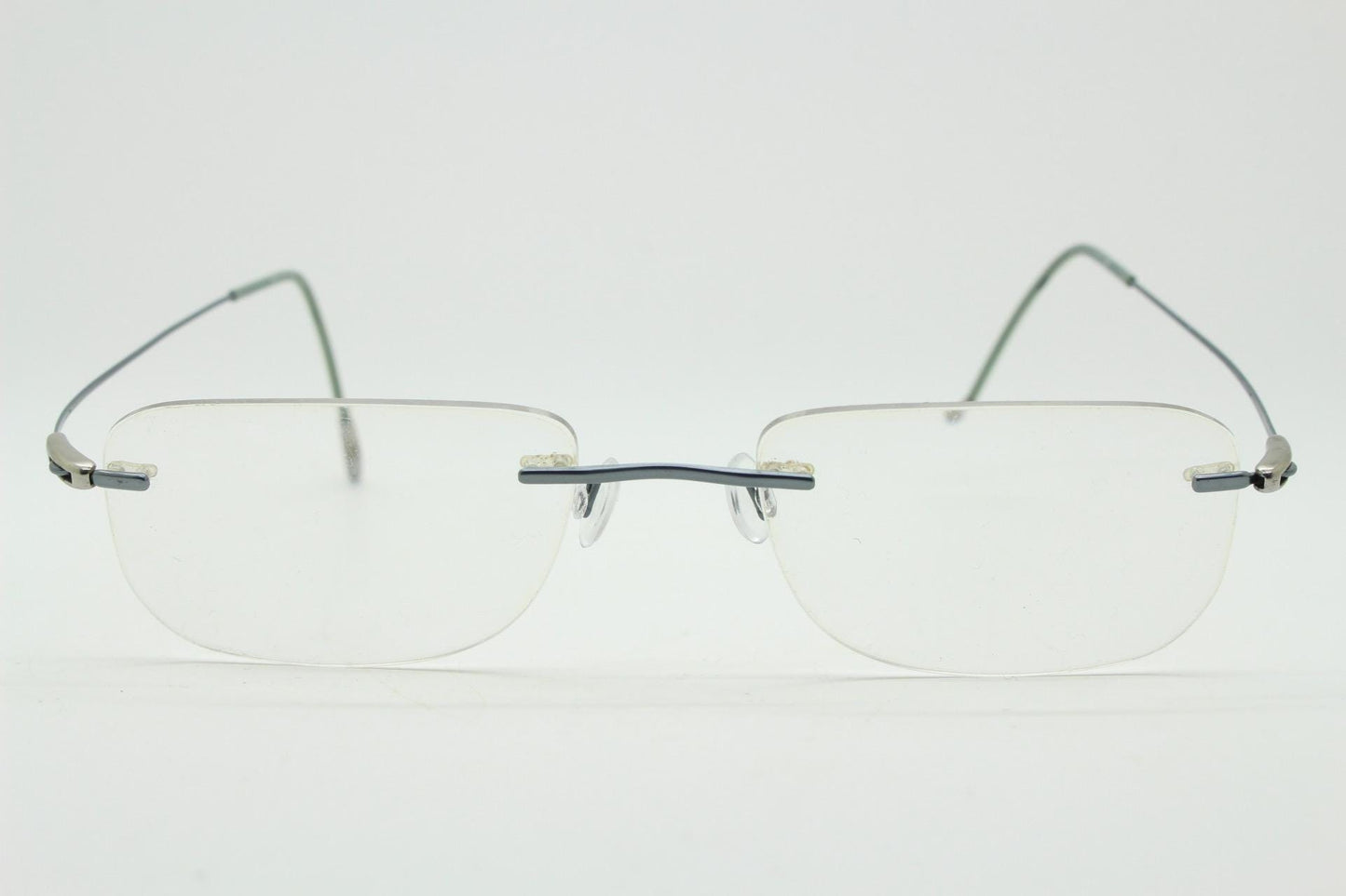 Silhouette rectangular frameless eye glasses model 7554 made in Austria. Minimal lightweight titanium optical frame. Prescription RX