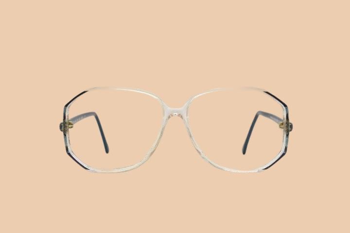 Silhouette 80s vintage hexagon eye glasses made in Austria. Transparent crystal optical frame with abstract blue pattern. Prescription. 70s