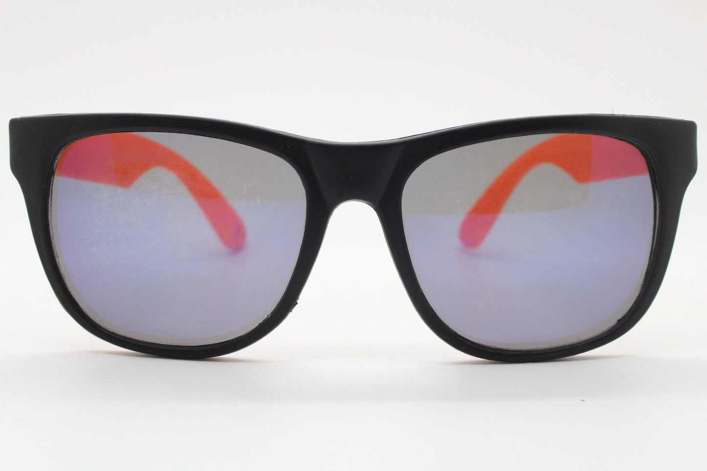 80s vintage 2 tone wayfarer style sunglasses. Matt black flexible rubber frame with orange dayglo arms. Unused NOS. Y2K fluorescent rave