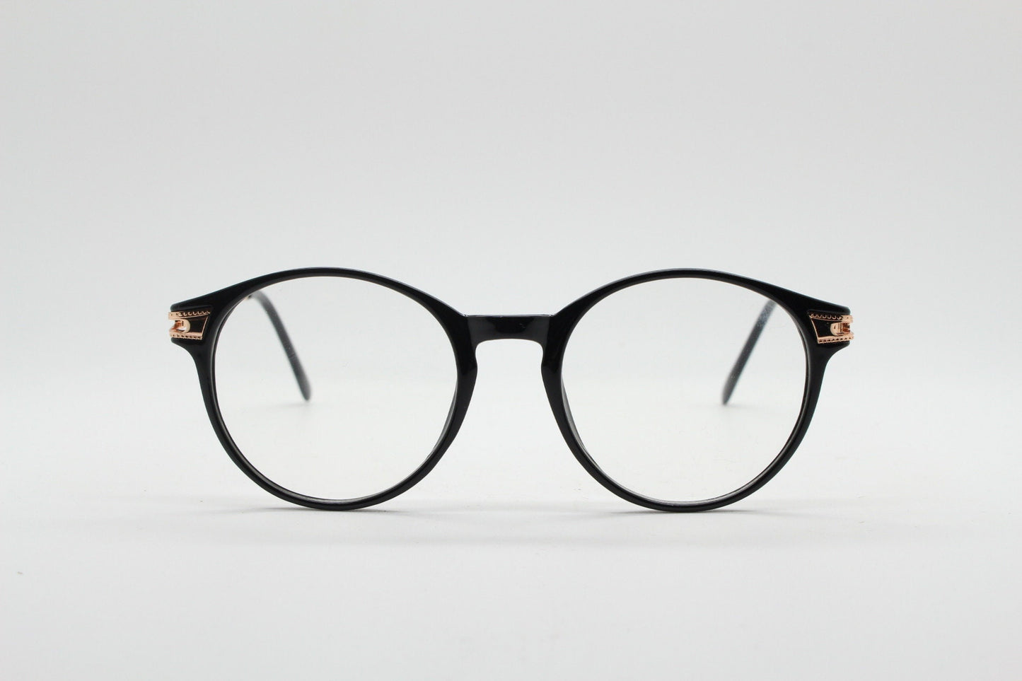 90s vintage round glasses with embossed gold  arms. Black 40s, 50s style prescription optical frames. Clear lens eyeglasses. RX spectacles