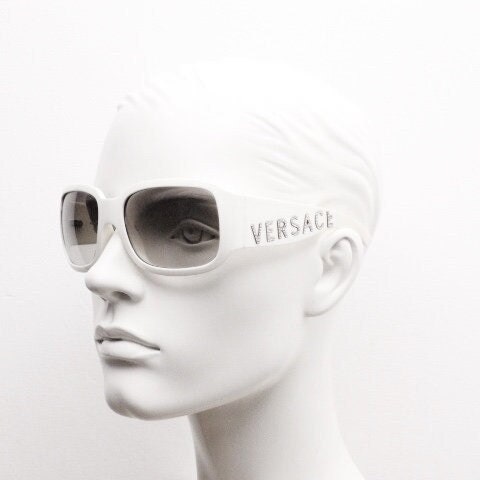 Versace Y2k vintage wrap around bug eye sunglasses. Curving white acetate shield frame with huge spell out diamante logo. 2000s. Rhinestone