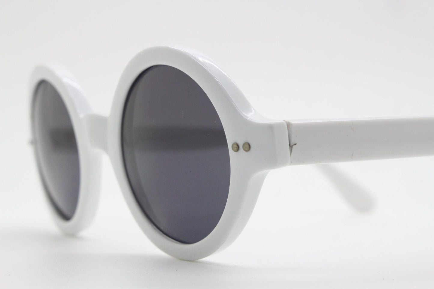 90s vintage round monochrome sunglasses. 30s design in an ice white frame with plain black lenses. Quality construction unused NOS