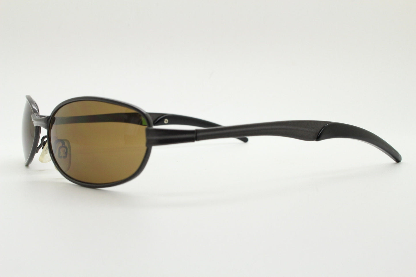 90s vintage oval small bug eye sunglasses. Curved brown satin finish solid metal frame with spear point rubber ends. Steampunk. Quality NOS
