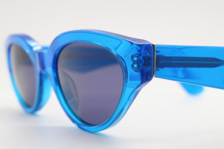 Retrosuperfuture thick cat eye sunglasses hand made in Italy. Intense blue acetate chunky frame with tasteful navy lenses. NOS
