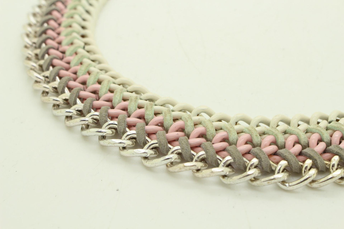 90s vintage 3 tier chain necklace. Solid metal construction in silver, pink, and white tones with grey rubber bonds. Adjustable back