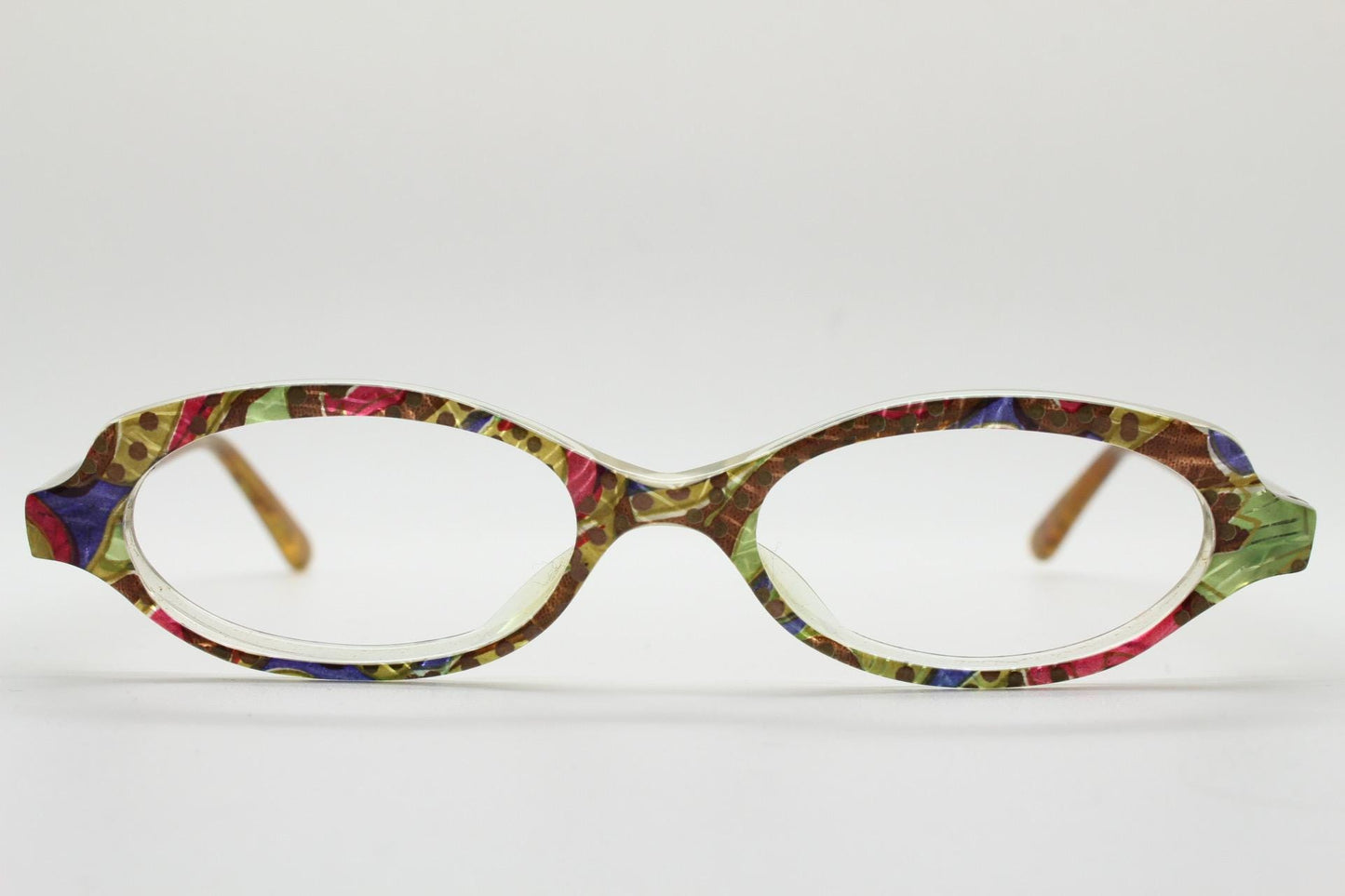 90s vintage small oval eye glasses. Low profile acetate optical frame with extraordinary abstract multi coloured pattern. Prescription RX