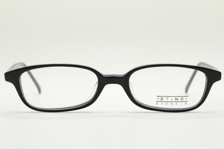 Sting 90s vintage rectangular eye glasses made in Italy. Plain black gloss low profile acetate optical frames. Prescription RX. NOS