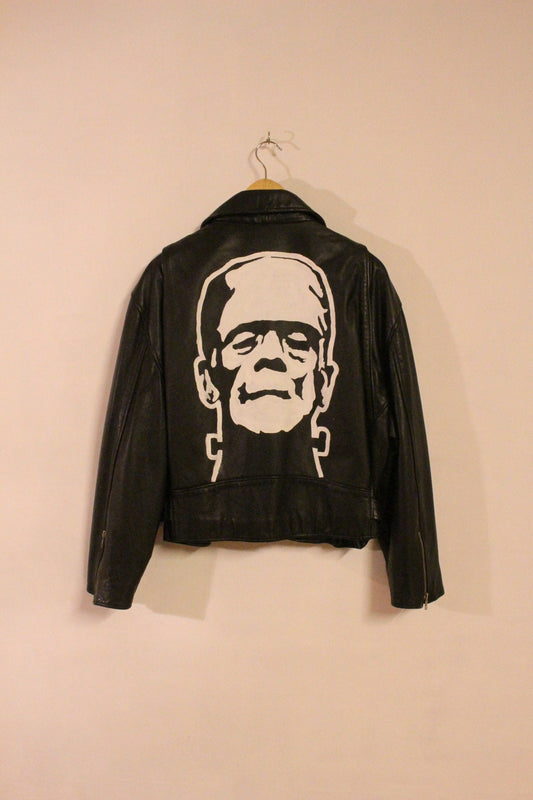 80s Vintage black motorcycle jacket with hand painted Frankenstein. Genuine leather biker with unique one off Boris Karloff design