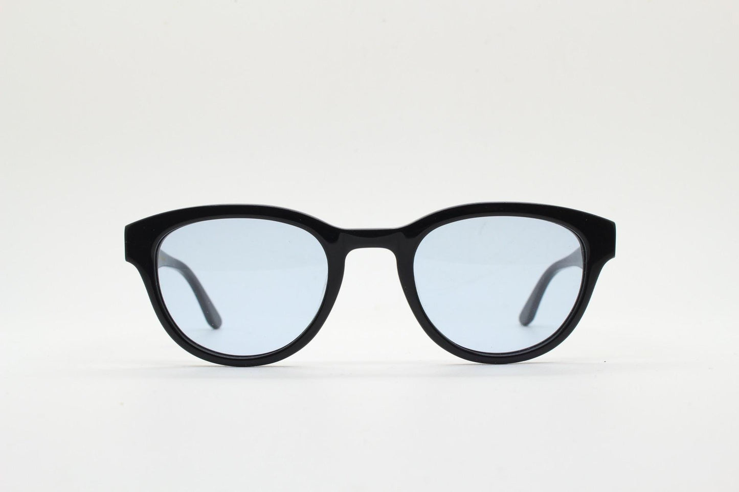 Vintage modified wayfarer design sunglasses. Black gloss acetate frame with extra light tone blue lenses in ideal proportions. NOS