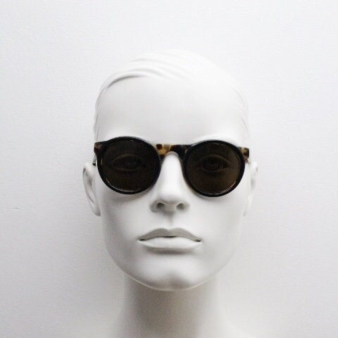 Francois Pinton Paris 90s vintage round sunglasses made in France. Womens thick acetate frame in honey tortoise brown tones. NOS