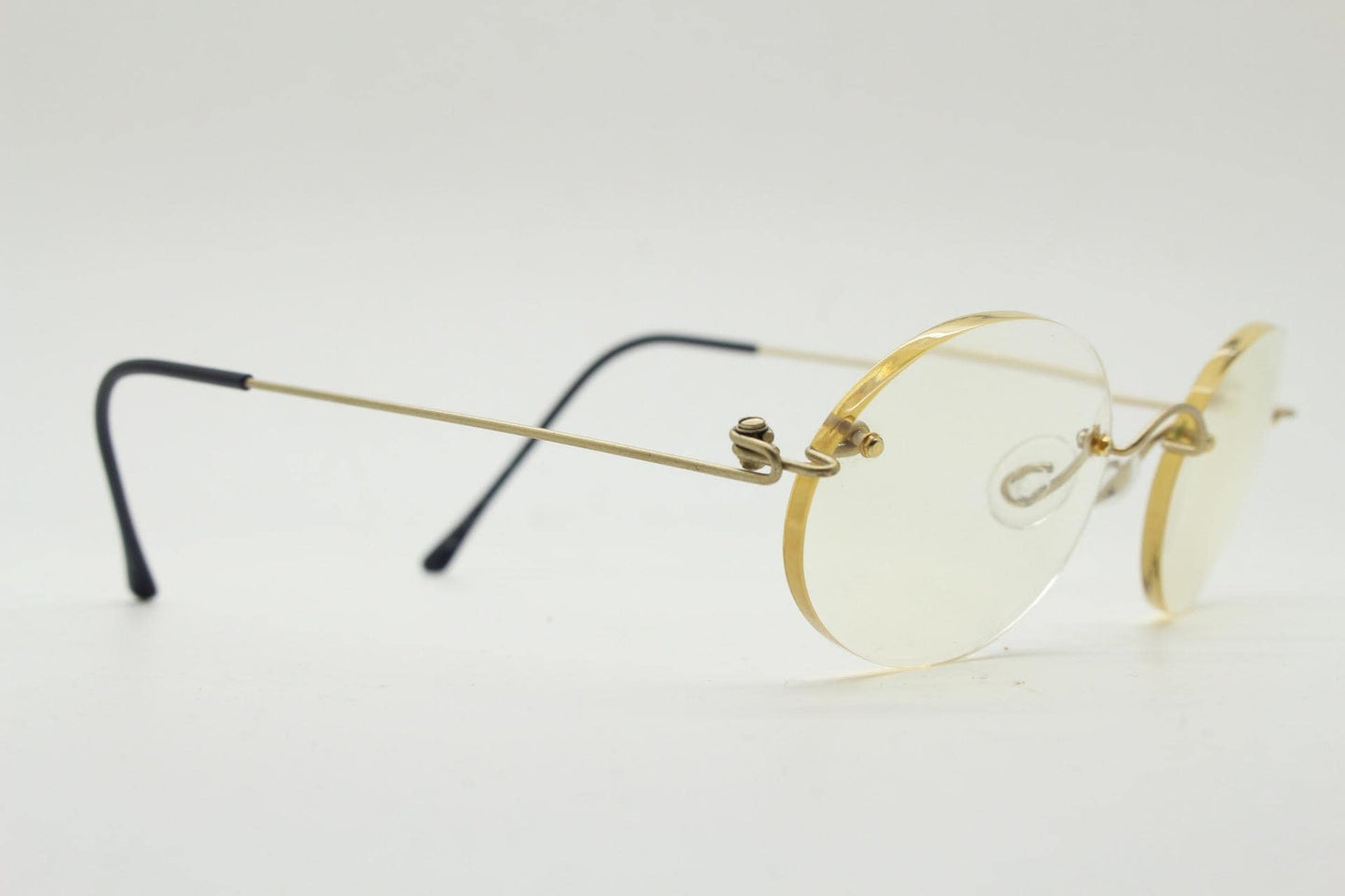 TRY vintage oval frameless eye glasses made in Italy. Futuristic minimal lightweight gold titanium optical frame. RX Spectacles