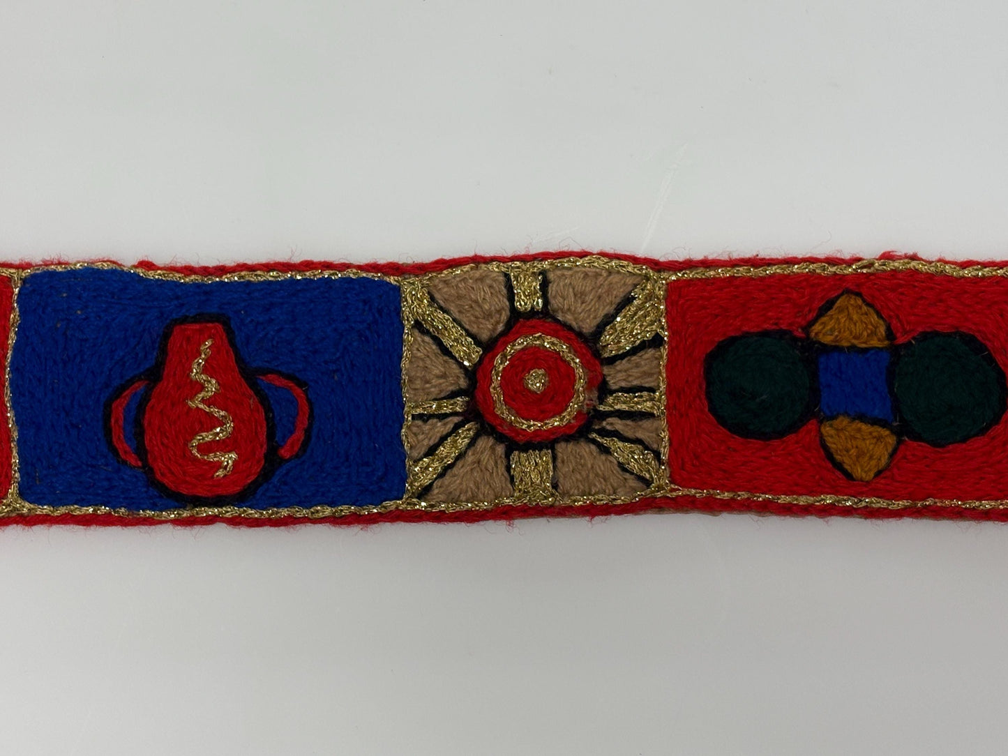 60s vintage completely hand made knitted belt. Embroidered sun, bird and abstract symbols with leather laced tie. Womens unique one off