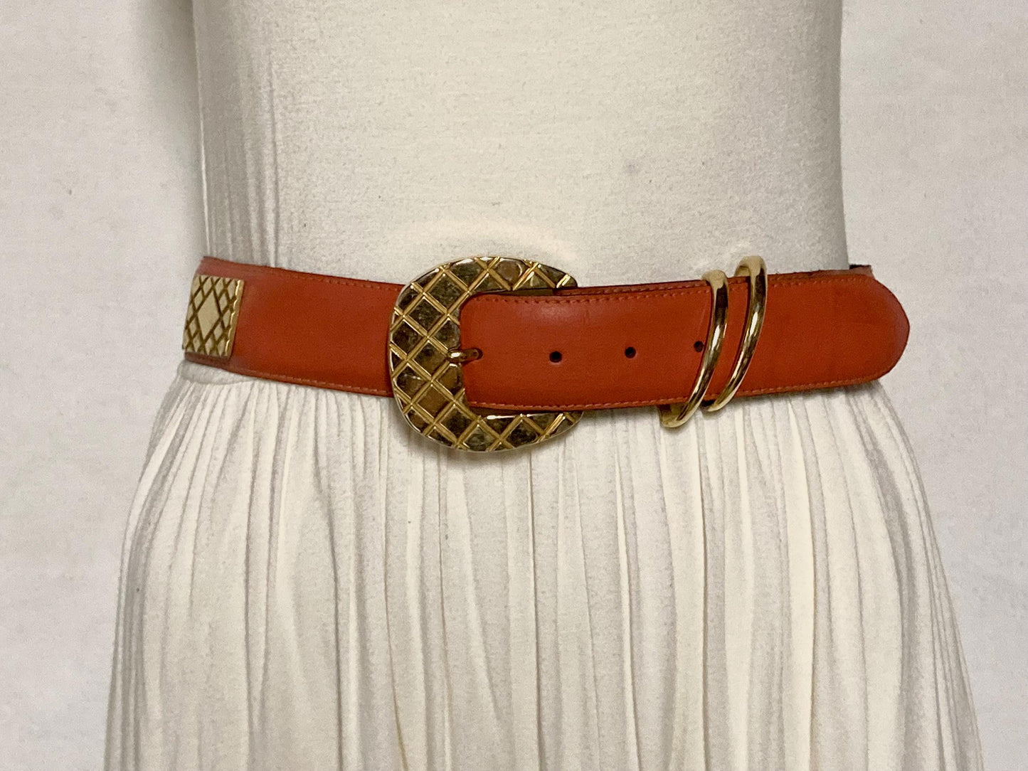 80s vintage womens dress / jeans belt in bright orange leather with golden metal squares. Made in France. Used in good condition