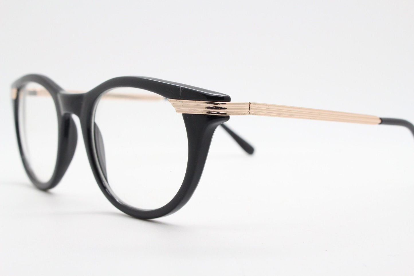 90s vintage cat eye glasses in black with gold metal arms. 50s, 60s style cateye prescription optical frames. Clear lens eyeglasses. RX