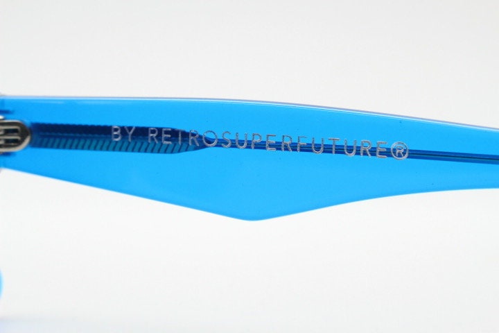 Retrosuperfuture thick cat eye sunglasses hand made in Italy. Intense blue acetate chunky frame with tasteful navy lenses. NOS