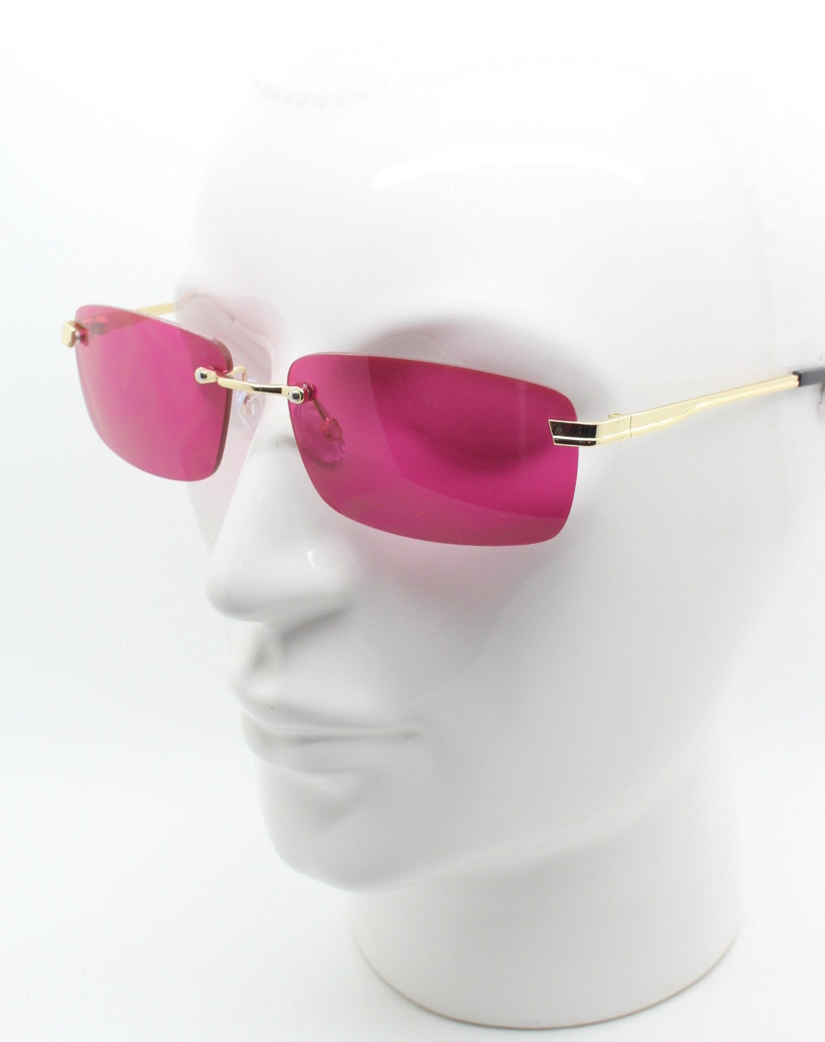 Y2K vintage frameless pink sunglasses. Rectangular lenses with gold bridge and arms. 2000s club kids. 00's. 90s Rave