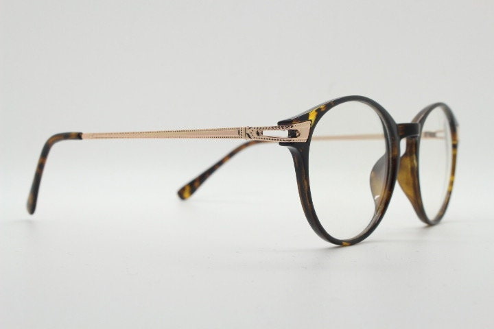 90s vintage round glasses with tortoise front and gold embossed arms. 40s, 50s style prescription optical frames. Clear lens eyeglasses. RX