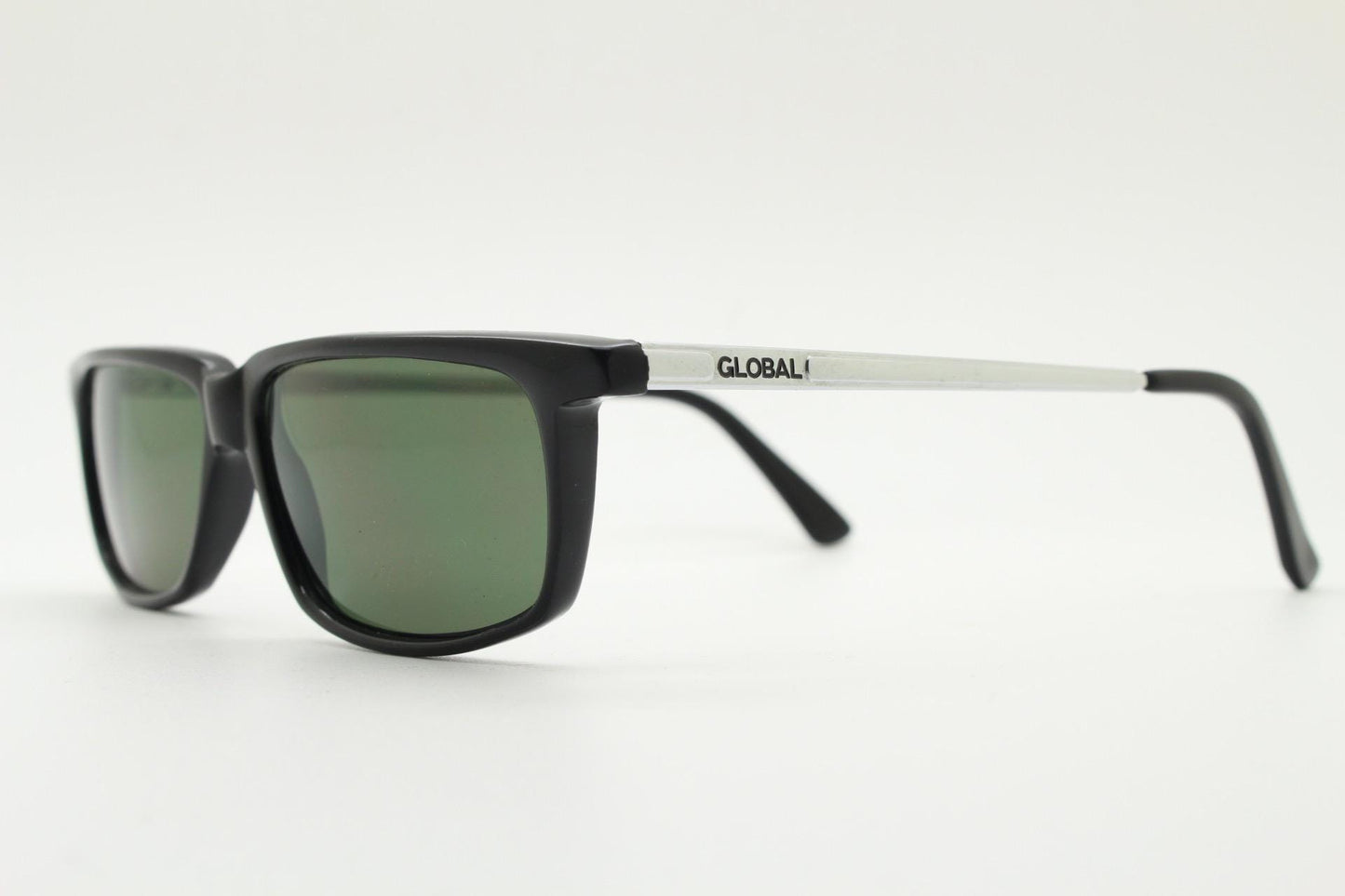 Global Eyewear vintage 90s vintage rectangular low profile sunglasses model 4330. Black flat top frame with silver chrome arms. NOS