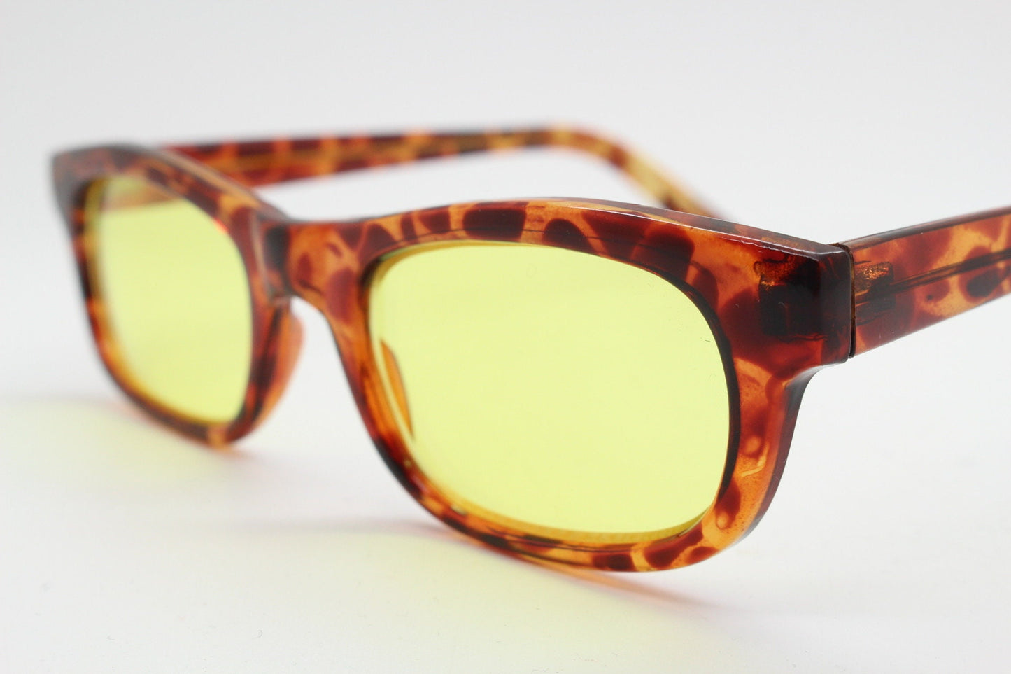 80s vintage rectangular sunglasses. Low profile 60s design tortoise frame with psychedelic light tone canary yellow lenses. BNWT Unused NOS