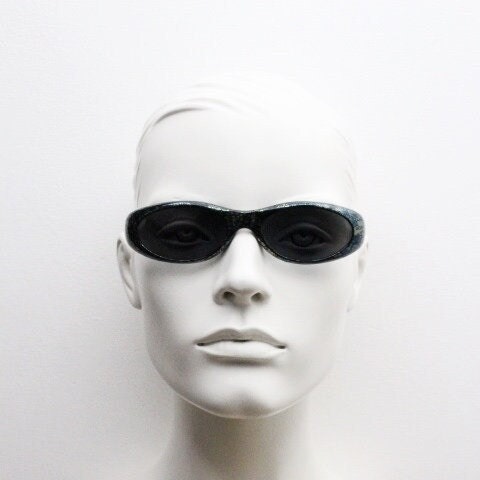 Killer Loop Shedevil 90s vintage shield sunglasses made in Italy. Low profile wrap around design with unique metallic print. One off sample