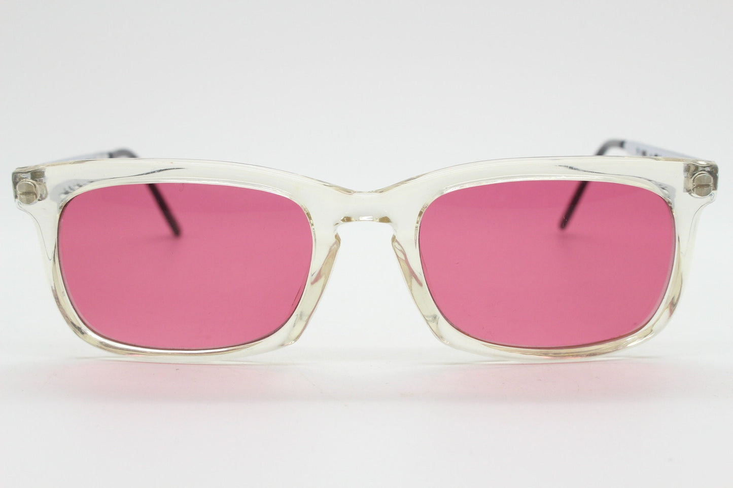 90s vintage futuristic crystal  sunglasses. Rectangular transparent frame with extraordinary arm cut outs and shocking pink lenses. NOS