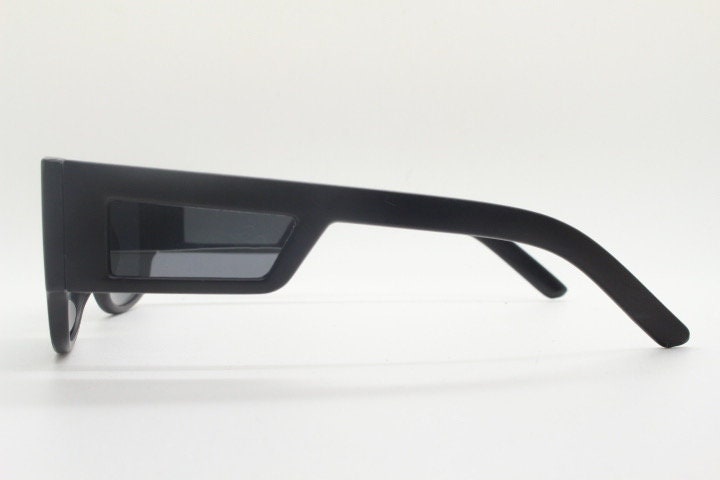 Y2K vintage rectangular side panel sunglasses. Black matt frame with grey lenses and side window spoilers / blinkers. 2000s NOS goggle
