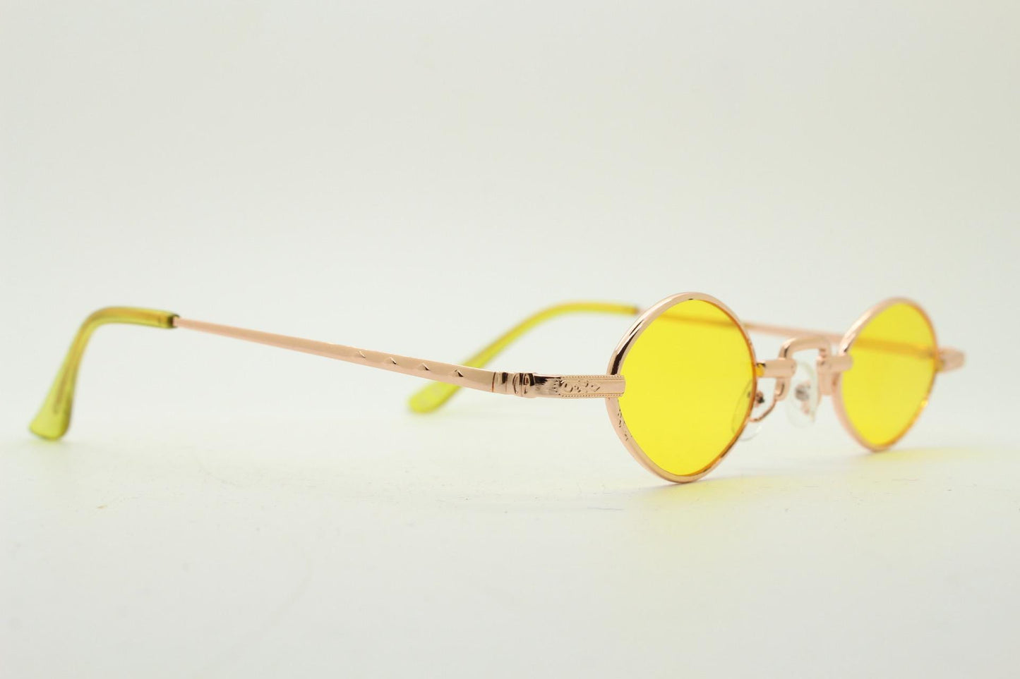 90s vintage small oval sunglasses. Imposing minimal rose gold metal victorian style frame with yellow lenses. Steampunk. BNWT