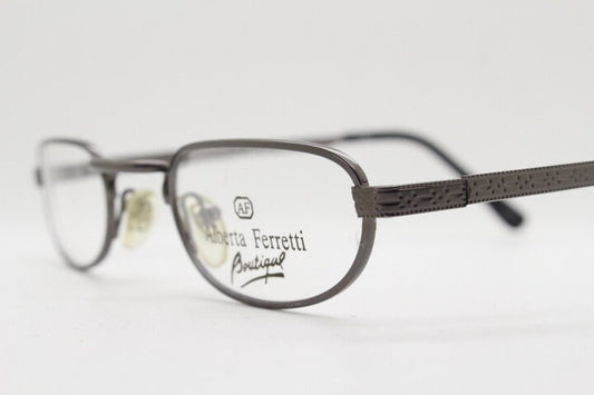 Alberta Ferretti 90s vintage oval eye glasses made in Italy. Small grey metal optical frame with ornate arm pattern. Prescription RX. NOS
