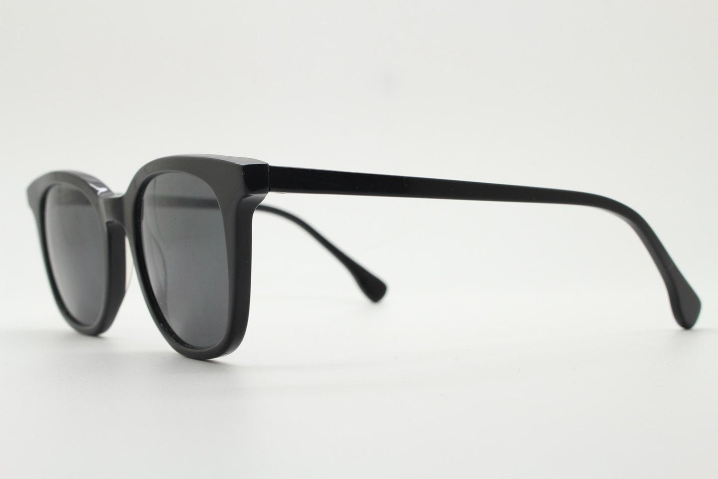 Vintage 90s slim frame black horn rim sunglasses. All time classic retro refined wayfarer design in gloss with black lenses