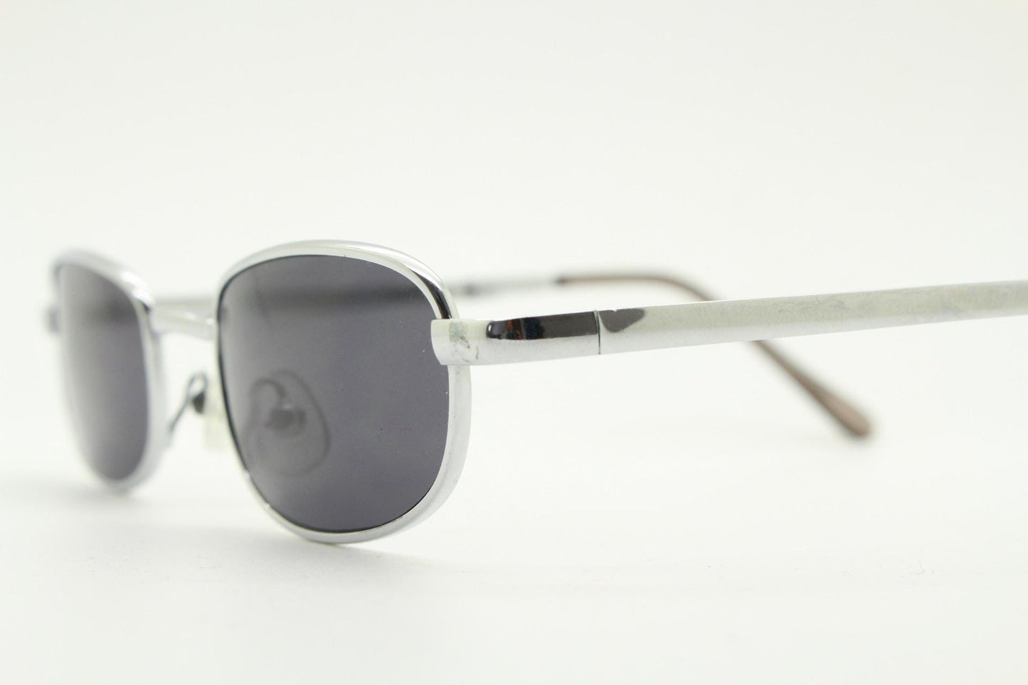 90s micro foldable rectangular sunglasses. Dark grey lenses in a small chrome folding compact frame. Folder. Rave 2000s. Y2K NOS