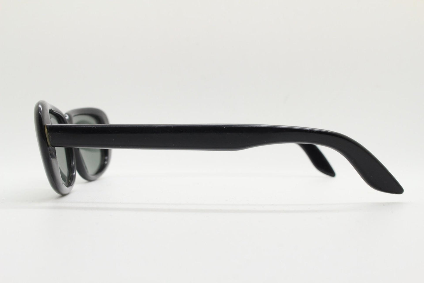 Polaroid 60s vintage rectangular sunglasses made in England. Authentic plain black frame with atmospheric curved lenses. Mens mod