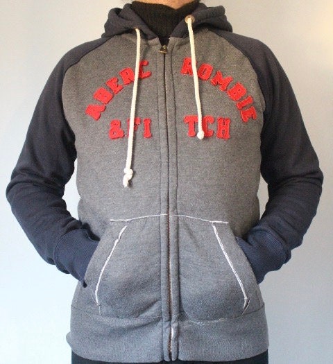 Abercrombie and Fitch grey and blue zipper sweat hoody with large red spell out patch letter chest logo. Mens all cotton medium size
